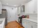 Well-equipped kitchen boasting stainless steel appliances, bright lighting, and hardwood floors at 905 Carroll St, Durham, NC 27701