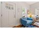 Cozy living room featuring a blue accent chair and hardwood flooring at 905 Carroll St, Durham, NC 27701