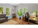 Spacious home office or study with windows and hardwood floors at 905 Carroll St, Durham, NC 27701