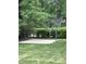 Backyard featuring a basketball court and lush greenery at 9301 Brookton Ct, Raleigh, NC 27615