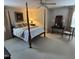 Spacious bedroom featuring a four-poster bed and coordinated decor at 9301 Brookton Ct, Raleigh, NC 27615