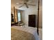 This bedroom has a four-poster bed, ceiling fan and matching chair at 9301 Brookton Ct, Raleigh, NC 27615
