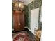 Stylish hallway with bold wallpaper, a decorative wardrobe, and unique accents at 9301 Brookton Ct, Raleigh, NC 27615