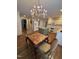 Bright kitchen with center island, white appliances, and hardwood floors at 9301 Brookton Ct, Raleigh, NC 27615