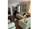 Cozy living room with hardwood floors, comfortable seating, and elegant decor creating a welcoming space at 9301 Brookton Ct, Raleigh, NC 27615