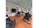 Inviting sunroom filled with comfortable wicker furniture and a TV at 9301 Brookton Ct, Raleigh, NC 27615