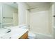 Bathroom with a tub and shower combination featuring a light wood vanity at 942 S Fifth St, Mebane, NC 27302