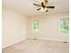 Bedroom with a ceiling fan and two windows at 942 S Fifth St, Mebane, NC 27302