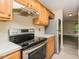 An open concept kitchen offering updated appliances and views to the living area at 942 S Fifth St, Mebane, NC 27302