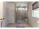Modern bathroom featuring a glass-enclosed shower with a built-in seat and a window for natural light at Lot 8 Cooper St, Sanford, NC 27330