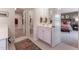 Bathroom view including vanity, walk-in closet, and natural light, promoting a peaceful atmosphere at Lot 8 Cooper St, Sanford, NC 27330