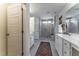 Spacious bathroom featuring shower, vanity, and ample lighting for a refreshing and functional space at Lot 8 Cooper St, Sanford, NC 27330