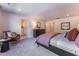 Charming bedroom boasts a seating area, soft carpet, and warm decor, enhancing its comfortable appeal at Lot 8 Cooper St, Sanford, NC 27330