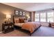 Inviting bedroom with ample natural light, modern decor, and stylish furniture creates a cozy retreat at Lot 8 Cooper St, Sanford, NC 27330