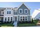 Charming new construction two-story home with gray and white exterior and manicured lawn at Lot 8 Cooper St, Sanford, NC 27330