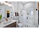 Bathroom featuring a glass enclosed shower, decorative mirror, and modern fixtures at 1 Deer Run Trl, Hillsborough, NC 27278