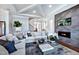 Bright living room features a cozy fireplace, modern finishes, and stylish decor with neutral colors throughout at 1 Deer Run Trl, Hillsborough, NC 27278