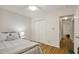 Bright bedroom with hardwood floors and closet space at 101 Creekview Cir, Carrboro, NC 27510