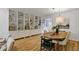 Elegant dining area featuring a stylish light fixture and beautiful built-in shelving at 101 Creekview Cir, Carrboro, NC 27510