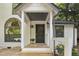 Charming front porch with inviting decor and a freshly painted door at 101 Creekview Cir, Carrboro, NC 27510