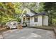 Attractive home with a cozy front deck and well manicured landscaping at 101 Creekview Cir, Carrboro, NC 27510