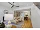 Bright living room with hardwood floors, fireplace, and ample natural light at 101 Creekview Cir, Carrboro, NC 27510