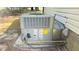 This outside AC unit is sitting on a concrete slab with visible piping at 1011 Wyldewood Rd, Durham, NC 27704