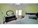 This bedroom features a black dresser with mirror, a ceiling fan, and carpet at 1011 Wyldewood Rd, Durham, NC 27704
