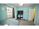 Cozy bedroom with a bed, tv and neutral-toned walls creating a relaxing retreat at 1011 Wyldewood Rd, Durham, NC 27704