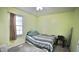 This bedroom features a window with natural light and carpet at 1011 Wyldewood Rd, Durham, NC 27704