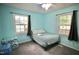 Bright bedroom featuring a comfortable bed, ample natural light, and a serene atmosphere at 1011 Wyldewood Rd, Durham, NC 27704