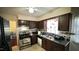 Functional kitchen with classic cabinets, stainless steel appliances, and plenty of counter space at 1011 Wyldewood Rd, Durham, NC 27704