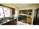 Well-equipped kitchen with updated appliances and laundry nook for added convenience at 1011 Wyldewood Rd, Durham, NC 27704