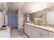 Bright bathroom features dual vanities with granite countertops and ample cabinet space at 1013 Chelsea Run Ln, Apex, NC 27502