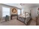 Bedroom with decorative accents, a large bed, and natural light at 1013 Chelsea Run Ln, Apex, NC 27502