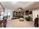 Large bonus room with display cabinets, carpeting, and seating area at 1013 Chelsea Run Ln, Apex, NC 27502