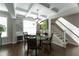 Elegant dining room featuring coffered ceilings, modern chandelier, and stylish decor at 1013 Chelsea Run Ln, Apex, NC 27502