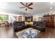 Spacious living room with hardwood floors, ceiling fan, and comfortable seating at 1013 Chelsea Run Ln, Apex, NC 27502