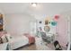 Bedroom with a vaulted ceiling and décor including posters and paper flower decorations and natural lighting at 105 Chandon Dr, Princeton, NC 27569