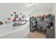 Bright bedroom featuring a built-in loft bed, a desk area, and shelves for storage and display at 105 Chandon Dr, Princeton, NC 27569