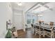 Beautiful dining room featuring coffered ceilings, hardwood floors, and lots of natural light at 105 Chandon Dr, Princeton, NC 27569