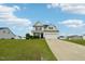 Charming two-story home with a well-manicured lawn and an extra long driveway at 105 Chandon Dr, Princeton, NC 27569