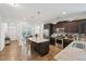 Modern kitchen featuring stainless steel appliances, granite countertops, and a spacious island at 105 Chandon Dr, Princeton, NC 27569