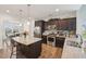 Modern kitchen featuring stainless steel appliances, granite countertops, and a spacious island at 105 Chandon Dr, Princeton, NC 27569