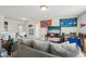 Cozy living room with fan memorabilia, neutral colored sofa, and a view to other rooms at 105 Chandon Dr, Princeton, NC 27569