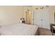 Cozy bedroom features neutral walls, a closet with double doors, and an adjacent room entryway at 11 Grifton Pl, Durham, NC 27704