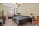 Cozy bedroom with neutral tones, ceiling fan, and ample natural light at 11 Grifton Pl, Durham, NC 27704