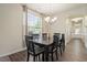 Elegant dining room showcases sleek wood floors and a stylish chandelier at 11 Grifton Pl, Durham, NC 27704