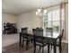 Inviting dining room features a modern chandelier and a window view at 11 Grifton Pl, Durham, NC 27704