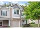 Charming townhouse featuring a brick facade, attached garage, and well-maintained landscaping at 11 Grifton Pl, Durham, NC 27704
